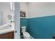 Half bathroom with bright two-tone paint and tile floors at 902 Grand Hilltop Dr, Apopka, FL 32703