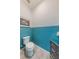 Half bathroom with bright two-tone paint and tile floors at 902 Grand Hilltop Dr, Apopka, FL 32703