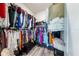 Organized walk-in closet with lots of hanging space, drawers, and bench seating at 902 Grand Hilltop Dr, Apopka, FL 32703