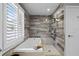 Spa-like bathroom features a modern tub, glass shower, and stylish gray tiling at 910 Alameda St, Orlando, FL 32804