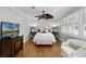 Comfortable bedroom featuring hardwood floors, and shuttered windows for natural light at 910 Alameda St, Orlando, FL 32804