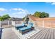 Spacious rooftop deck with two lounge chairs, composite deck flooring, and white railings at 910 Alameda St, Orlando, FL 32804