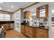 Charming kitchen with wood cabinets, granite countertops, and stainless steel appliances at 910 Alameda St, Orlando, FL 32804