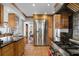 Spacious kitchen with a large stainless steel refrigerator and ample cabinet space at 910 Alameda St, Orlando, FL 32804