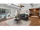 Cozy living room with a view of the pool through large sliding glass doors at 910 Alameda St, Orlando, FL 32804