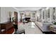 Bright living room with hardwood floors, fireplace, and plantation shutters providing ample natural light at 910 Alameda St, Orlando, FL 32804