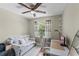 Bright bedroom with daybed, desk area, and window for a comfortable living space at 2652 Laser Ct, Orlando, FL 32826