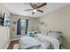 Bedroom with ceiling fan, plush rug, and a sun-filled window for a bright and inviting space at 2652 Laser Ct, Orlando, FL 32826