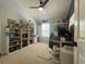 Bedroom with lots of décor, a desk, ceiling fan and filled bookshelves at 6327 Southbridge St, Windermere, FL 34786
