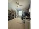 Bedroom with lots of décor, a desk, ceiling fan and filled bookshelves at 6327 Southbridge St, Windermere, FL 34786