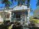 Charming blue two-story home with a cozy porch and well-maintained landscaping at 6327 Southbridge St, Windermere, FL 34786