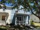 Charming blue two-story home with a cozy porch and well-maintained landscaping at 6327 Southbridge St, Windermere, FL 34786