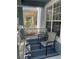 Relaxing porch with two chairs and a striped rug, offering a comfortable outdoor space at 6327 Southbridge St, Windermere, FL 34786