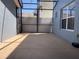 Enclosed screened patio offering ample space for relaxation, with views of the fenced backyard at 6327 Southbridge St, Windermere, FL 34786