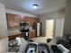 Functional kitchen featuring stainless steel appliances, ample counter space, and wood finish cabinetry at 14220 Morning Frost Dr, Orlando, FL 32828