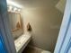 Cozy bathroom with marble countertop, sleek faucet, and modern lighting fixtures at 2141 Lake Margaret Dr # 11, Orlando, FL 32806