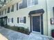 Two-story townhouse showing the front entry and garden area at 2141 Lake Margaret Dr # 11, Orlando, FL 32806