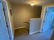 Carpeted hallway with two doors leading to the bedrooms, natural lighting, and base-molding at 2141 Lake Margaret Dr # 11, Orlando, FL 32806