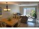 Bright living room-dining room combo, featuring light-colored furniture and a sliding glass door to the backyard at 2141 Lake Margaret Dr # 11, Orlando, FL 32806