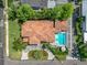 Stunning aerial view of this residence featuring a tile roof, lush landscaping and a sparkling pool at 2614 Parkland Dr, Winter Park, FL 32789