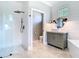 Elegant bathroom featuring a glass shower, shiplap walls, and a modern vanity with stylish lighting fixtures at 2614 Parkland Dr, Winter Park, FL 32789