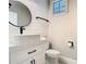 Stylish powder room with a vessel sink, shiplap walls, and black accents at 2614 Parkland Dr, Winter Park, FL 32789
