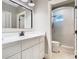 Bathroom features white cabinets, marble countertop, modern fixtures, and walk-in shower at 2614 Parkland Dr, Winter Park, FL 32789