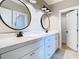 Bathroom featuring double vanity, dual mirrors, and modern fixtures at 2614 Parkland Dr, Winter Park, FL 32789