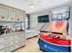 Unique bedroom setup featuring a basketball game and custom wood wall at 2614 Parkland Dr, Winter Park, FL 32789