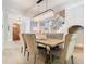 Elegant dining area featuring a crystal chandelier and staircase in the background at 2614 Parkland Dr, Winter Park, FL 32789