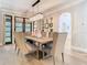 Dining room with a large table, stylish chairs, and a modern chandelier at 2614 Parkland Dr, Winter Park, FL 32789