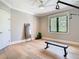 Bright exercise room with wood floors and a fitness mirror at 2614 Parkland Dr, Winter Park, FL 32789