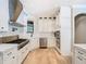 Bright kitchen with modern appliances, custom white cabinets, stainless steel hood, and ample counter space at 2614 Parkland Dr, Winter Park, FL 32789