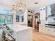 Bright kitchen with quartz counters, stainless appliances, decorative pendant lights, and an open floor plan at 2614 Parkland Dr, Winter Park, FL 32789