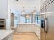 Bright open kitchen with quartz counters, pendant lights, stainless appliances and eat-in breakfast bar at 2614 Parkland Dr, Winter Park, FL 32789