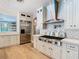 Modern kitchen with stainless steel appliances, white cabinets, and a large kitchen island at 2614 Parkland Dr, Winter Park, FL 32789