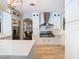 Stylish kitchen boasts stainless steel appliances, a modern range hood, and sleek white cabinetry at 2614 Parkland Dr, Winter Park, FL 32789