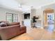 Stylish living room with a cozy sectional, TV, beverage cooler, and a built-in desk area at 2614 Parkland Dr, Winter Park, FL 32789