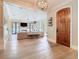 Inviting living room with hardwood floors, a fireplace, neutral decor, and natural light for cozy gatherings at 2614 Parkland Dr, Winter Park, FL 32789