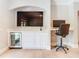 Comfortable living room with a built-in TV, beverage cooler, desk, and modern décor at 2614 Parkland Dr, Winter Park, FL 32789