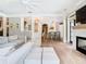 Bright living room featuring stylish white furniture and hardwood floors at 2614 Parkland Dr, Winter Park, FL 32789