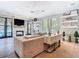 Bright living room with a fireplace, neutral decor, and lots of natural light at 2614 Parkland Dr, Winter Park, FL 32789