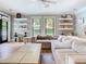 Spacious living room with large windows, stylish decor, and a neutral color scheme at 2614 Parkland Dr, Winter Park, FL 32789