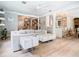 Bright living room featuring stylish white furniture and hardwood floors at 2614 Parkland Dr, Winter Park, FL 32789