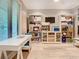 Bright office space with a large window, a white desk, and built-in shelving for storage at 2614 Parkland Dr, Winter Park, FL 32789