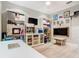 Functional office featuring a desk, shelving, and a TV, providing a comfortable workspace at 2614 Parkland Dr, Winter Park, FL 32789