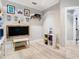 Cozy playroom area with a chalkboard, artwork, and shelving for organized storage and creative activities at 2614 Parkland Dr, Winter Park, FL 32789
