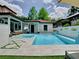 Backyard pool area with landscaping and outdoor seating, perfect for relaxation and entertainment at 2614 Parkland Dr, Winter Park, FL 32789