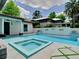 Backyard pool and patio featuring a hot tub, landscaping, and contemporary design at 2614 Parkland Dr, Winter Park, FL 32789