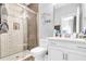 Modern bathroom with glass-enclosed shower, patterned tile, and contemporary fixtures at 2926 Crest Wave Dr, Clermont, FL 34711
